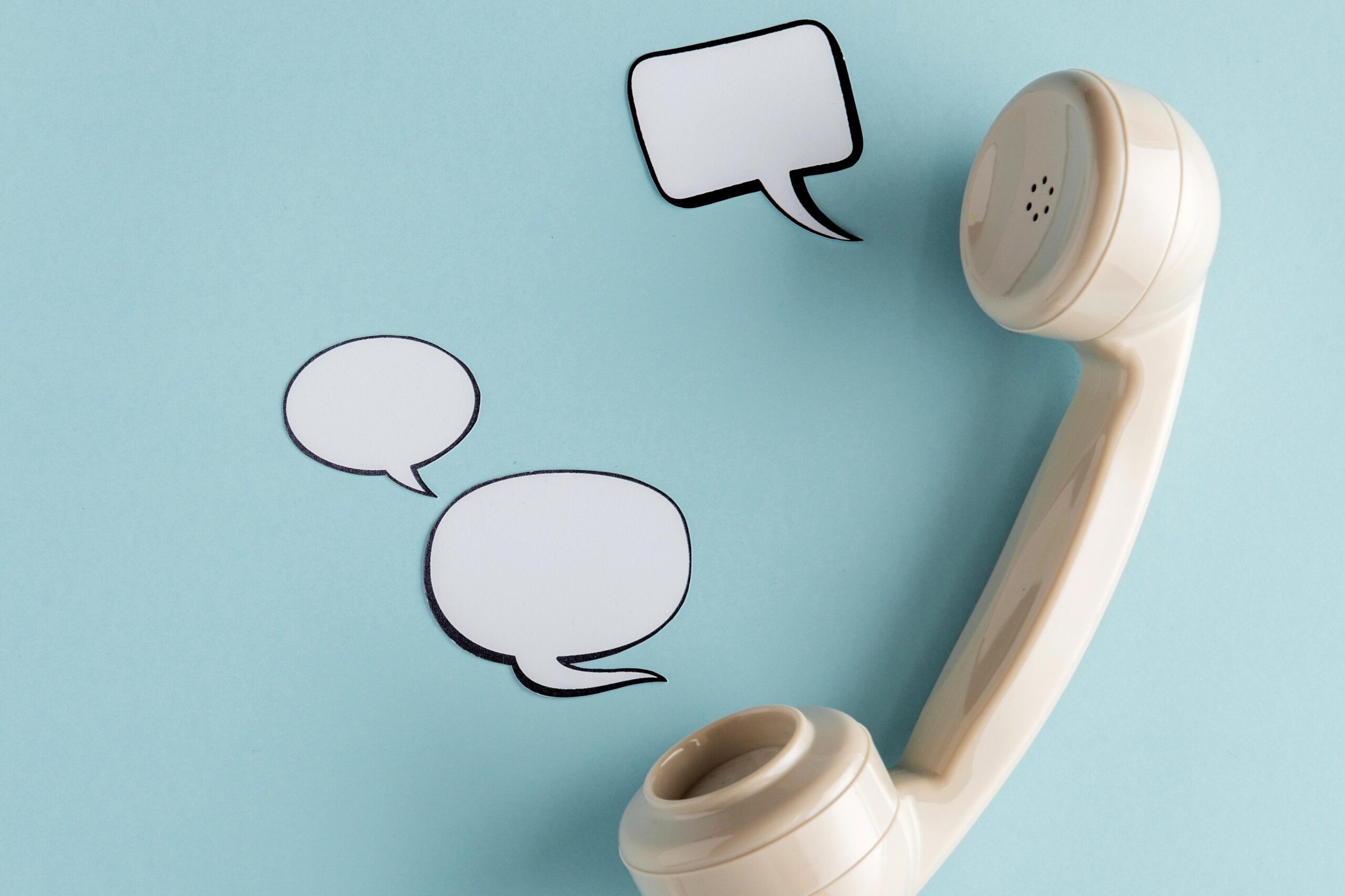 top view chat bubbles with telephone receiver copy space